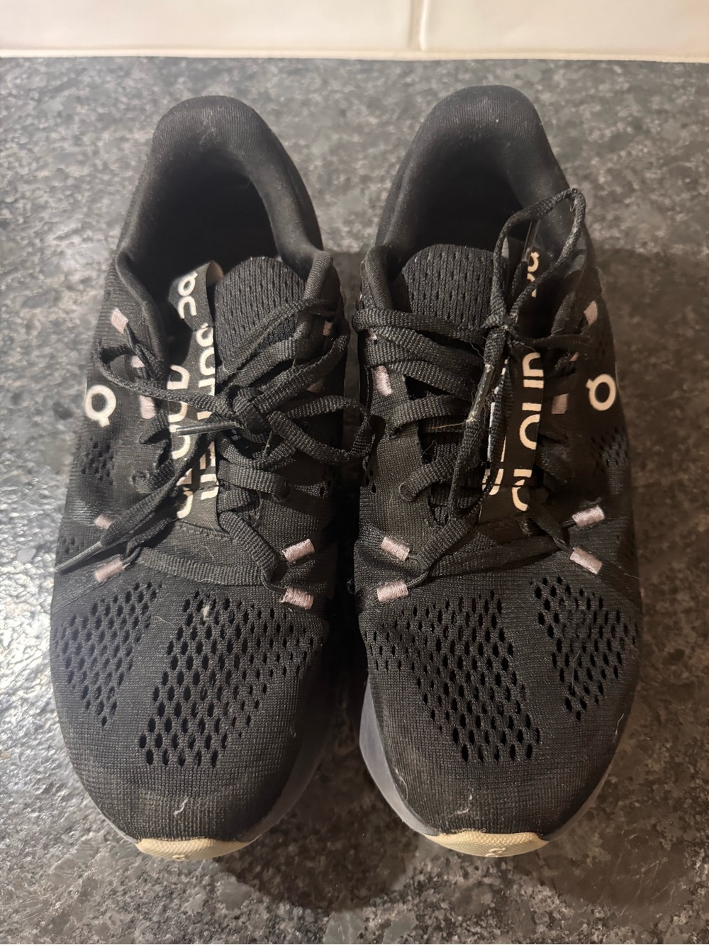 On Running Women’s Black Athletic Lace-Up Running Shoes with Subtle Pink Accents